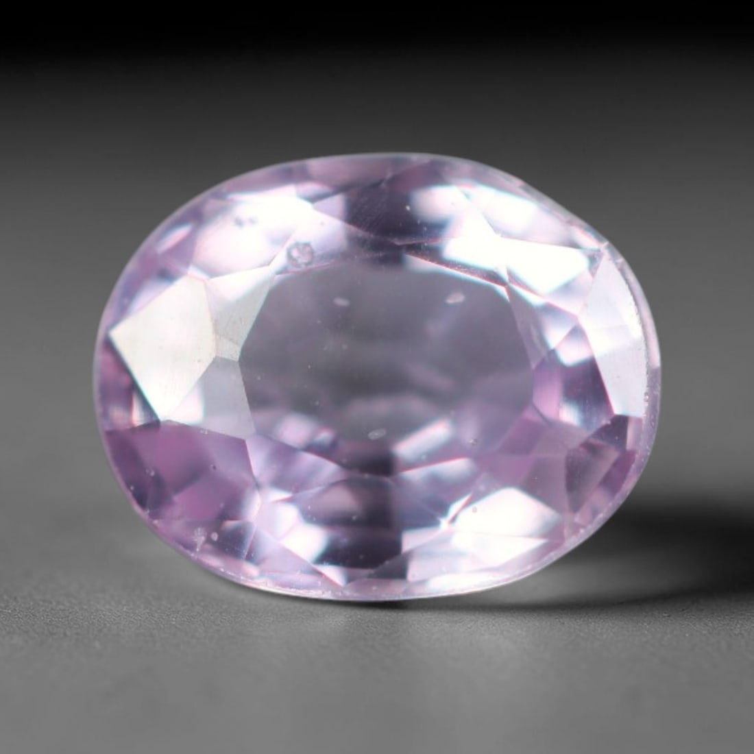 0.62 Carats Natural Soft Pastel Lavender Pink Sapphire Loose Faceted Gemstone, 27XM: Natural translucent pastel lavender-pink corundum sapphire finely faceted loose gemstone, oval brilliant cut delivers gentle light sparkle and displays a delicate pale lilac-pink hue across the clear 