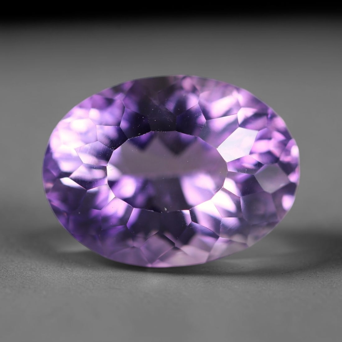 15.36 Carats Natural Brazilian Amethyst Loose Gemstone, 25WP: This natural Brazilian amethyst holds dimension readings of 18.4x13.7x10.7mm, a transparent crystalline quartz specimen sourced from Brazil's well-documented amethyst mineral formations that consisten
