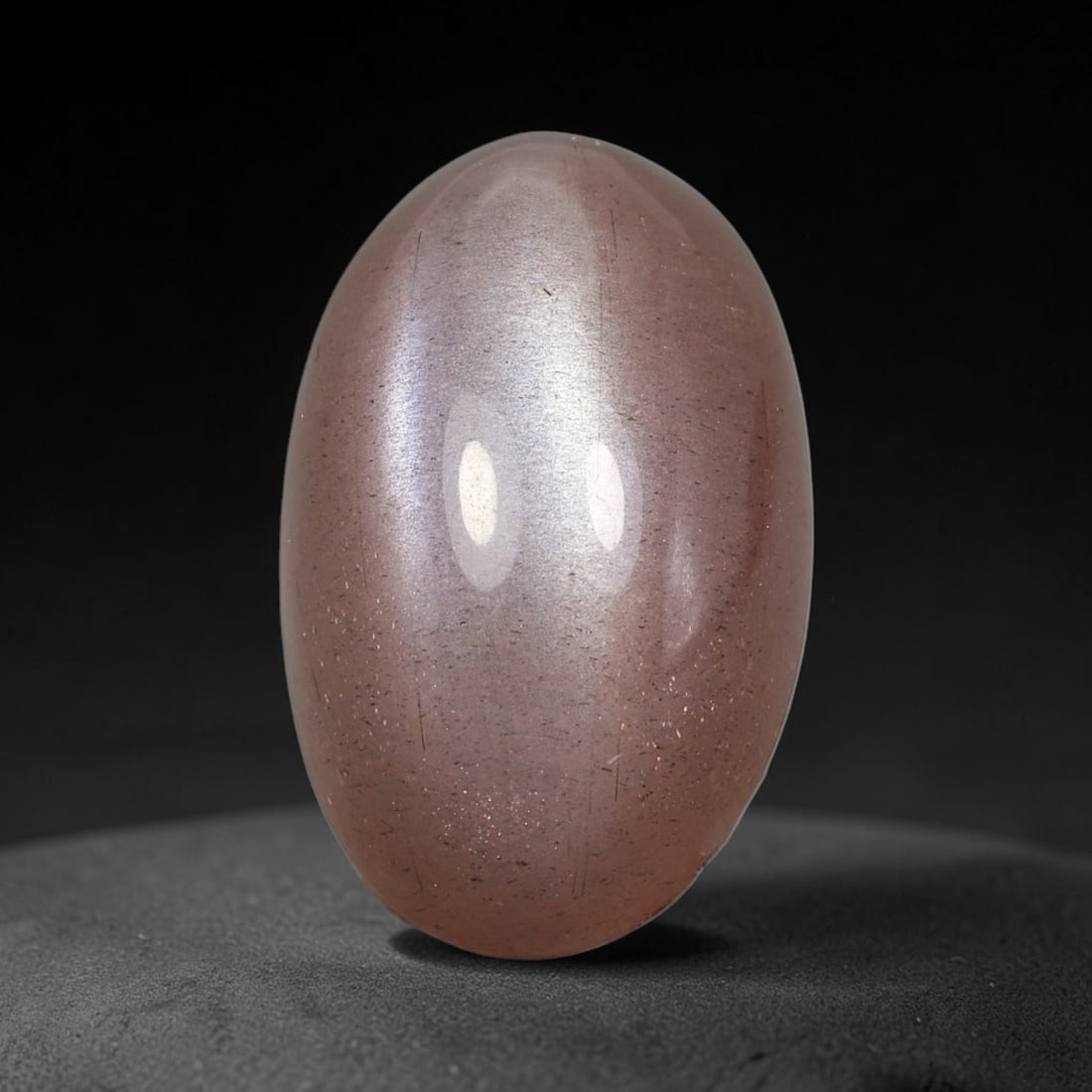 17.31 Carats Natural Ceylon Peach Moonstone Loose Gemstone, 52WJ: This natural Ceylon moonstone carries dimension measurements of 20.5x13x9.1mm, a premium feldspar mineral sourced from Ceylon's historic moonstone mining grounds celebrated for stones displaying chara