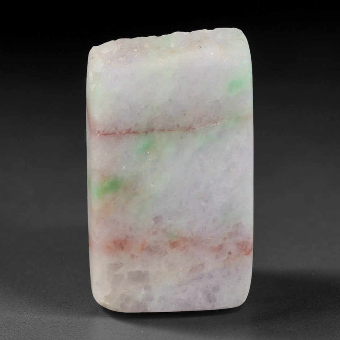 151ct Natural Type A Burmese Jadeite Jade Sliced Rough, 19YR: This specimen is a sliced rough block of natural Type A Burmese jadeite jade. The interior displays natural colour zoning with visible mineral veining and crystalline patterns typical of unprocessed j