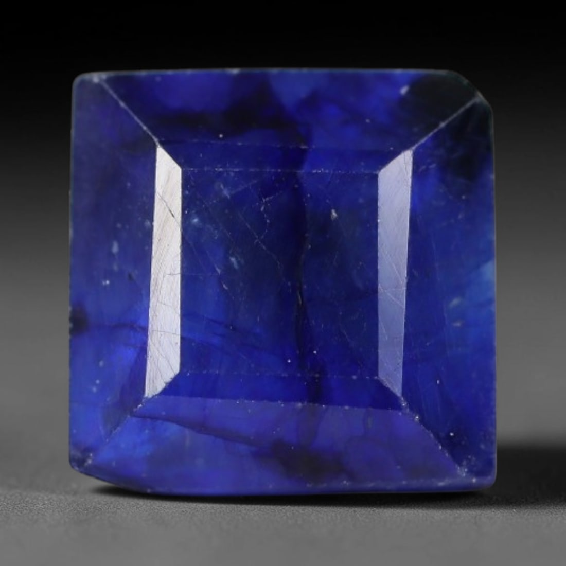 2.64 Carats Royal Blue Sapphire Square Emerald Cut Loose Gemstone, 35WS: This neat square emerald cut sapphire showcases deep, saturated royal blue color, enhanced by clean reflective step facets. Natural internal fine fissures and scattered tiny mineral specks can be obse