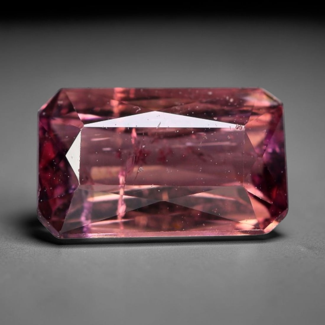 1.04 Carats Natural Pink Raspberry Emerald Cut Tourmaline Loose Faceted Gemstone, 97XV: Natural soft raspberry pink elbaite tourmaline expertly cut into a classic emerald rectangular faceted loose gemstone, designed with step-cut facets to deliver crisp linear light reflection and unifor