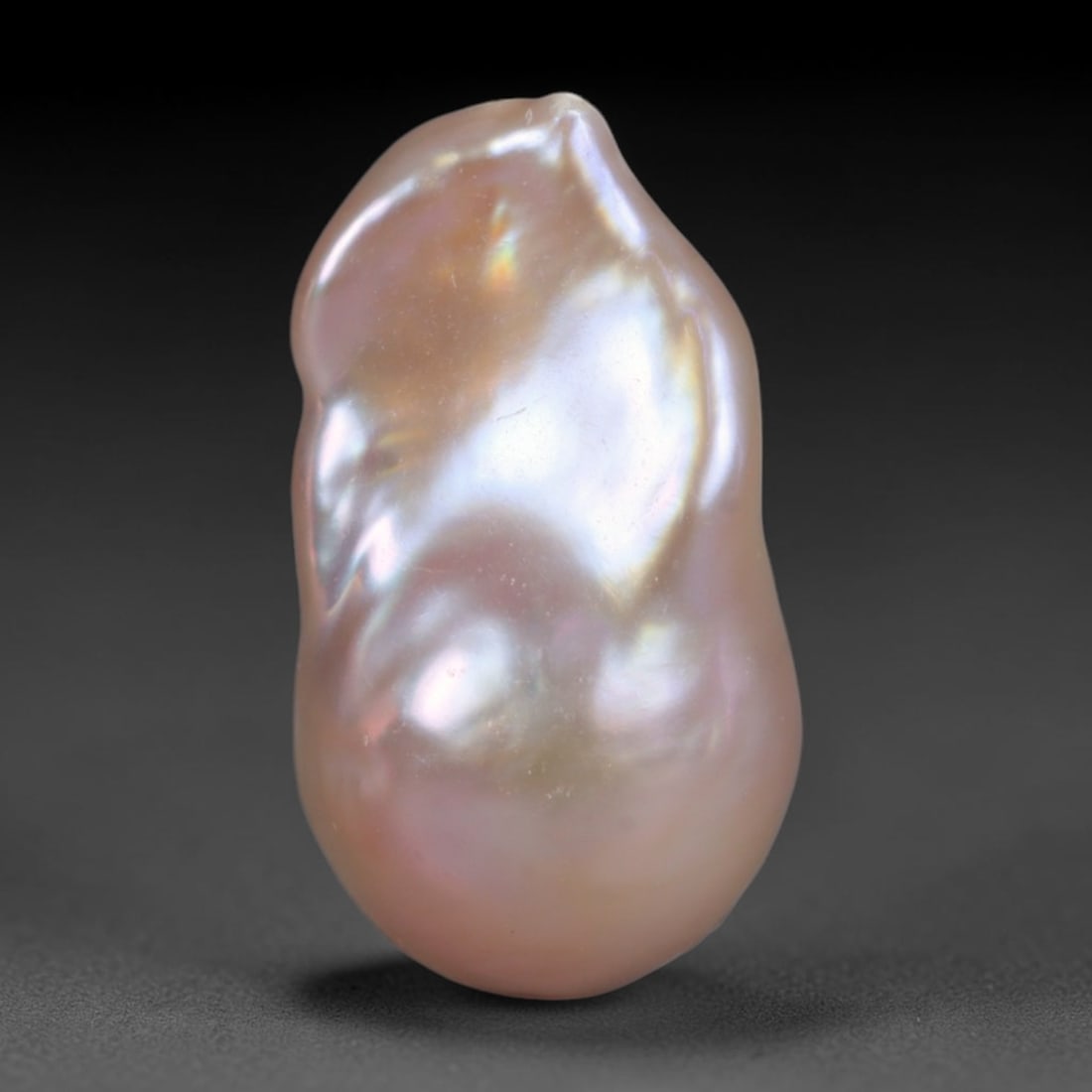 Natural Freshwater Keshi Pearl Baroque Loose Pearl, 81WE: This natural freshwater keshi pearl presents an organic irregular baroque silhouette with rich shifting iridescent nacre displaying soft champagne, peach and lavender overtones across its surface. Sub