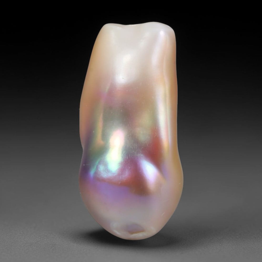 Natural Freshwater Keshi Pearl Baroque Loose Pearl, 93WE: This natural freshwater keshi pearl presents an organic irregular baroque silhouette with rich shifting iridescent nacre displaying soft champagne, peach and lavender overtones across its surface. Sub