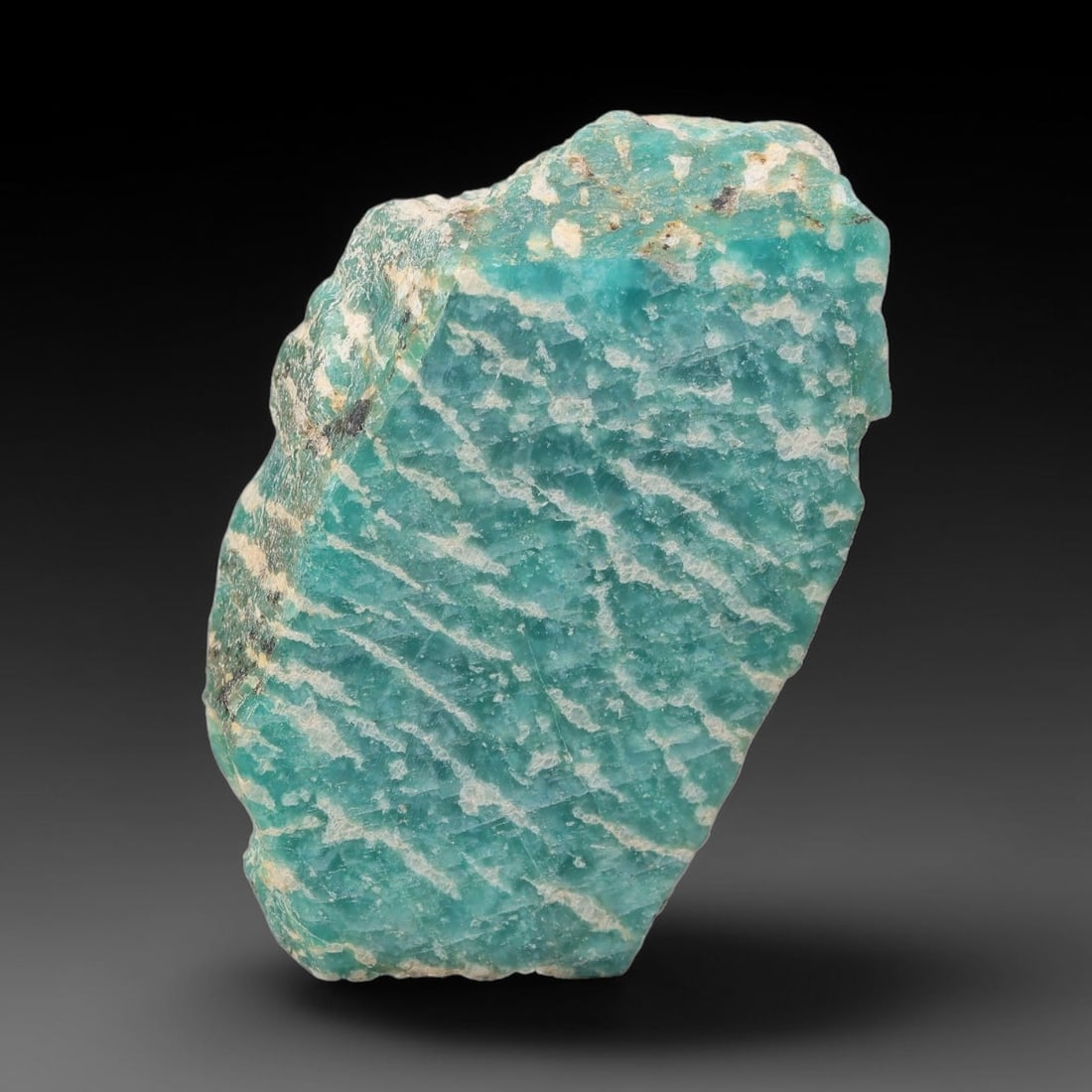 113ct Natural Russian Ural Amazonite Slab Rough, 36WV: This intact amazonite slab features distinct parallel mineral banding running uniformly across its naturally split flat surface within 47x25x13mm slab dimensions, retaining unmodified natural geologic