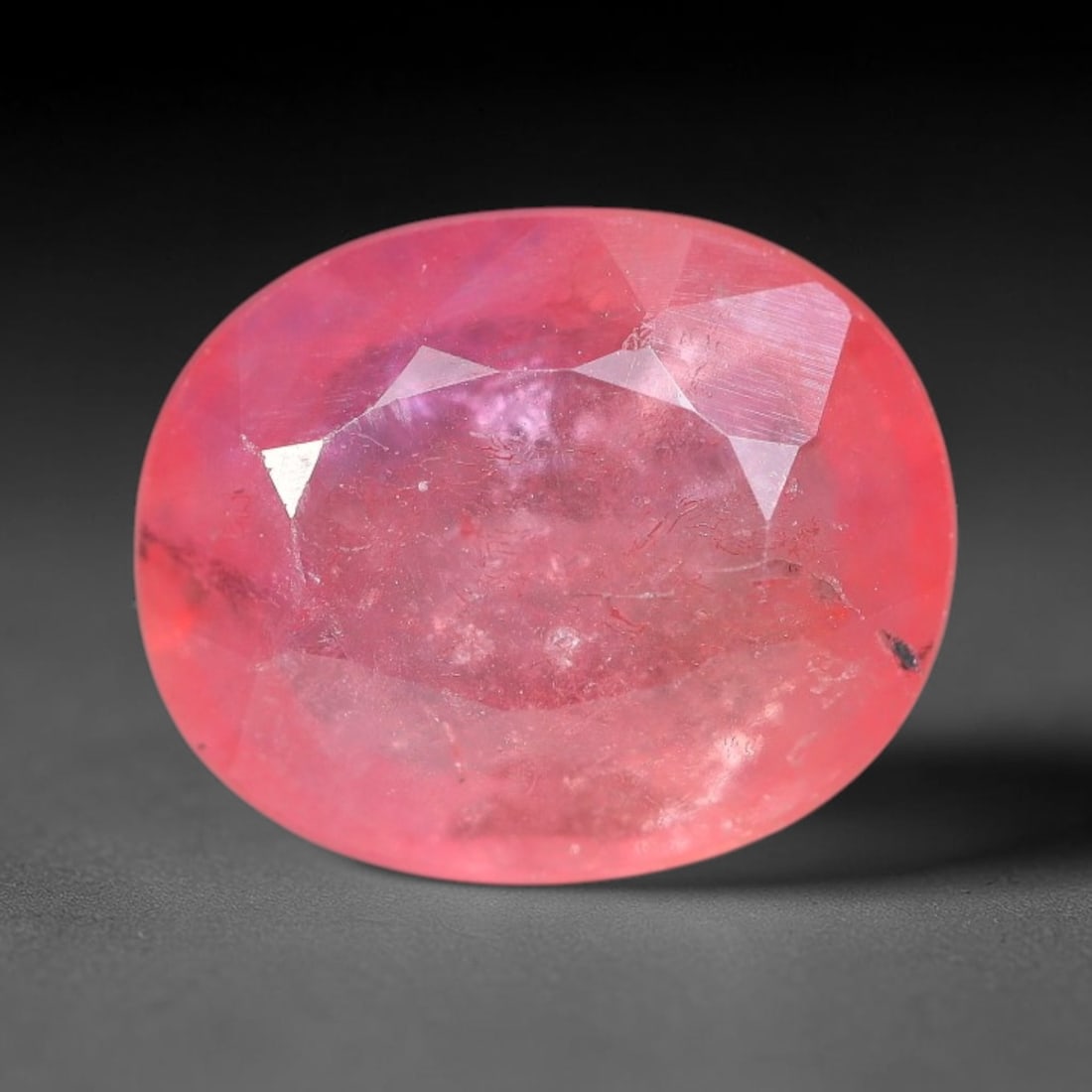 Certified 2.05 Carats Orange Pink Natural Ceylon Sapphire Single Oval Faceted Cut Gemstone, LZ847: This single oval faceted natural sapphire features vivid balanced orange-pink hue with consistent saturation across its 8.70 mm X 7.12 mm X 3.29 mm dimensions, precise symmetrical oval faceting delive
