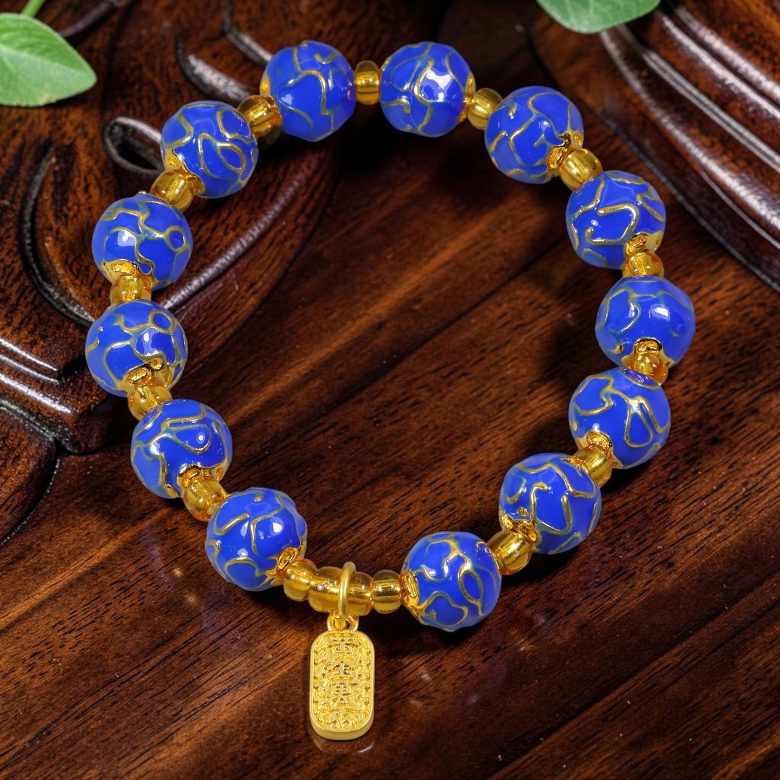 Chinese Cloisonne Enamel Beaded Bracelet - Blue Gold Tone Fortune Charm, 77YG: This modern Chinese revival stretch bracelet is crafted with round cloisonne enamel beads measuring 10.10 millimeters, finished in deep royal blue enamel overlaid with raised gold-tone cloud motif det