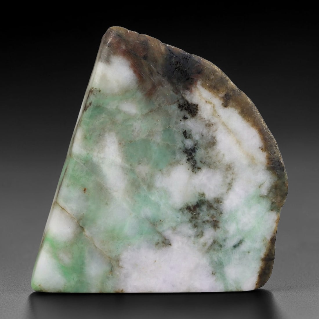 325ct Natural Type A Burmese Jadeite Jade Sliced Rough, 67YK: This specimen is a sliced rough block of natural Type A Burmese jadeite jade. The interior displays natural colour zoning with visible mineral veining and crystalline patterns typical of unprocessed j