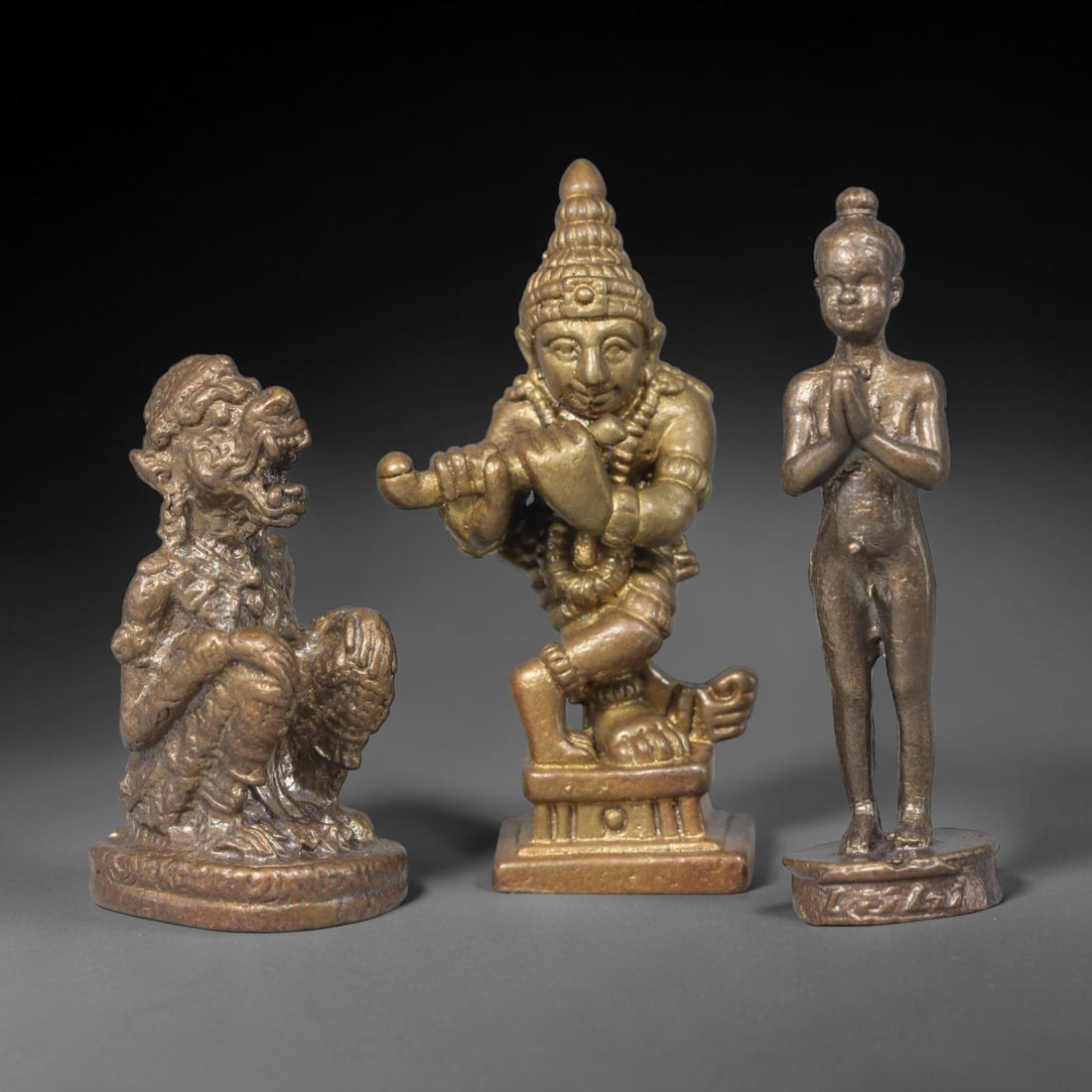 Vintage Thai Copper Alloy Miniature Buddhist Figurine Set - 3pcs Amulets, 97ZB: Three individually cast miniature copper alloy devotional statuettes of Thai folk Buddhist iconography, each measuring approximately 4 cm tall and 1.5 cm wide at base. The set comprises a seated Hanum