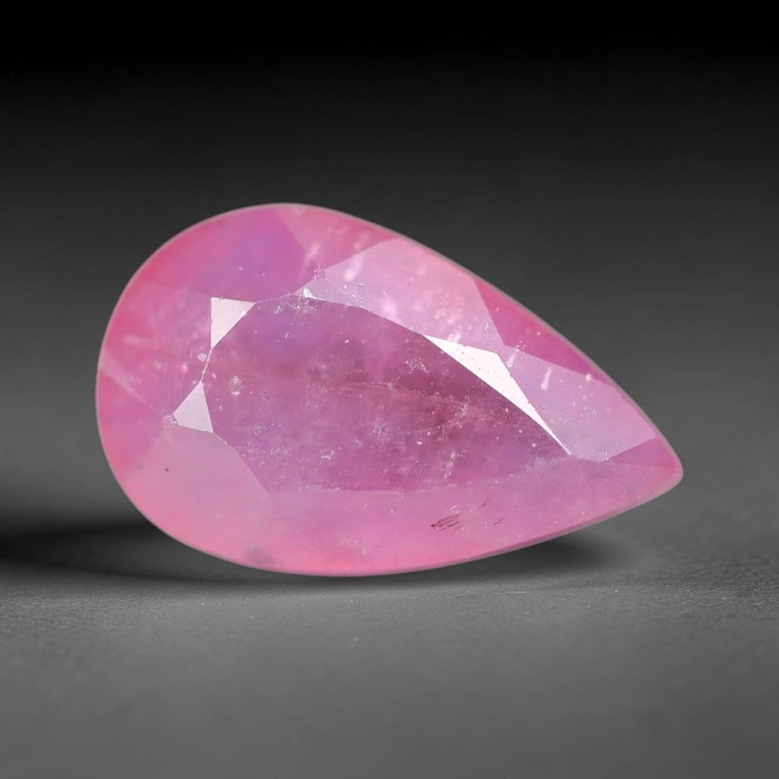 Certified 1.51 Carats Orange Pink Natural Ceylon Sapphire Single Pear Faceted Cut Gemstone, LZ849: This single pear faceted natural sapphire holds smooth blended orange pink color with consistent tone saturation across its 9.41 mm X 5.75 mm X 3.08 mm measurements, classic pear silhouette with preci
