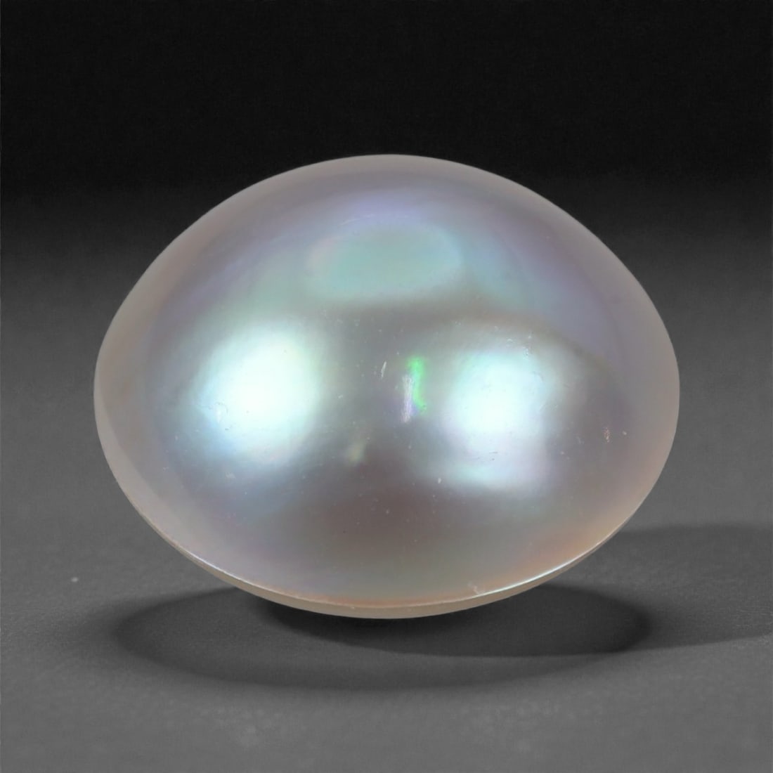 7.16 Carats Silvery Lavender Baroque Pearl - Natural Cultured Gem - 14 mm, 45WE: This luminous baroque pearl displays a soft silvery lavender hue, accented by delicate overtones of aqua, rose, and pale gold. Its fluid, organic shape embodies the natural beauty of cultured pearls, 