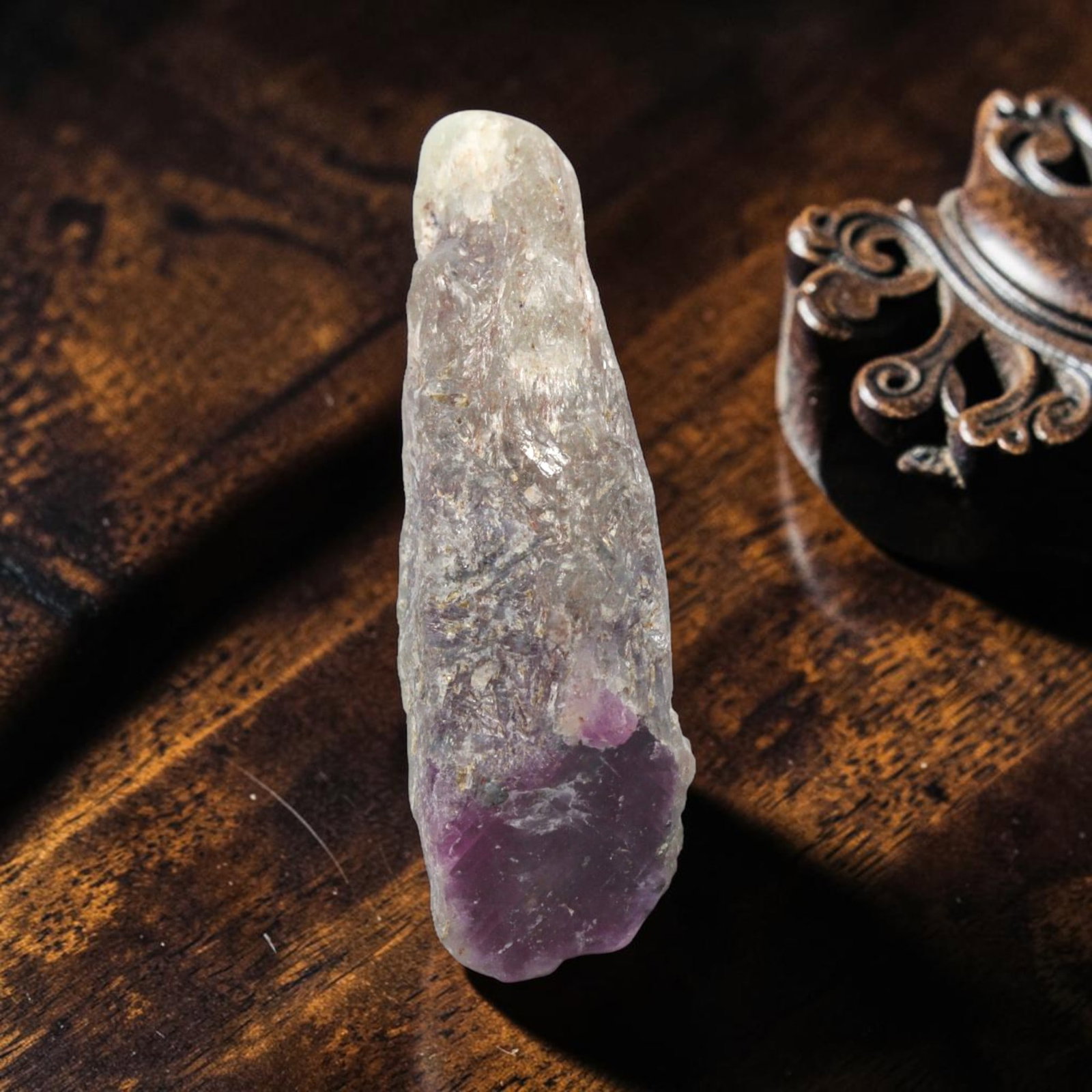 26.54ct Natural Mauritania Ruby Rough (Unheated), 61XE: This unheated Mauritania ruby rough is a captivating natural crystal specimen, featuring vivid magenta-purple ruby formations embedded in a contrasting greyish matrix. The stone's rugged, unpolished s