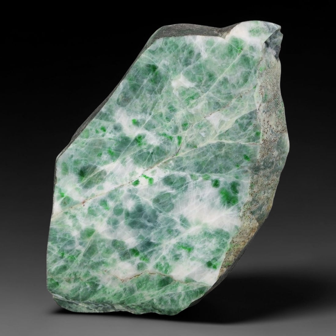 360ct Natural Type A Burmese Jadeite Jade Sliced Rough, 3YK: This specimen is a sliced rough block of natural Type A Burmese jadeite jade. The interior displays natural colour zoning with visible mineral veining and crystalline patterns typical of unprocessed j
