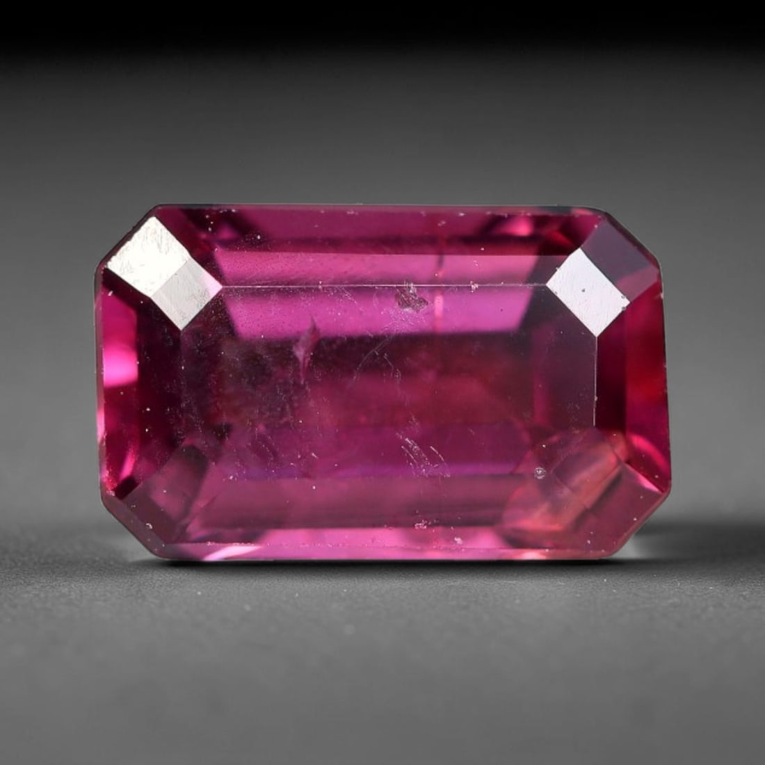 1.26 Carats Natural Deep Burgundy Red Garnet Faceted Loose Gemstone, 19WJ: This timeless faceted garnet boasts a luxuriously deep burgundy red tone that glows with vivid crimson fire across its precisely polished reflective facets. Fine natural micro mineral specks are scatt