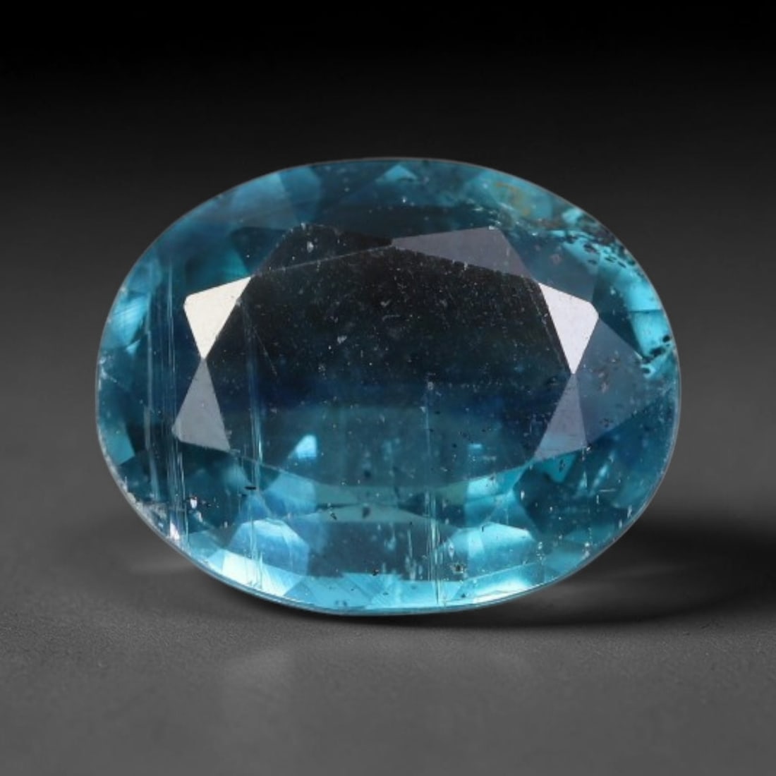 2.61 Carats Natural Deep Teal Blue Kyanite Oval Faceted Loose Gemstone, 20WS: This well-proportioned oval faceted kyanite boasts rich saturated teal-cornflower blue hue radiating through crisp polished step facets, with characteristic fine natural mineral inclusions and tiny da