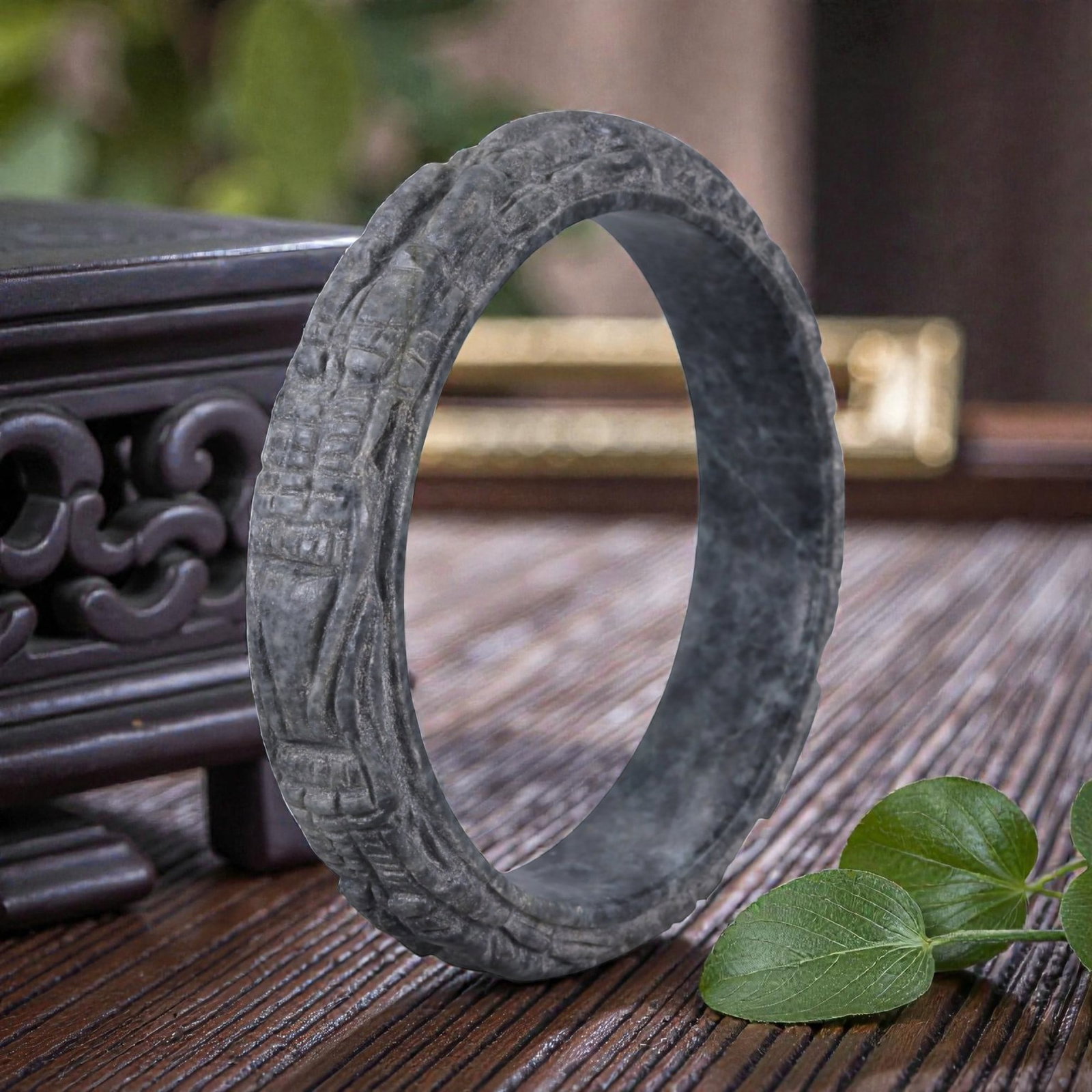 Jadeite Jade Dragon Bracelet - Carved Asian Bangle, 6.3cm Inner Diameter, 25WE: Carved from dense grey-green jadeite, this bracelet is formed as a continuous circular bangle with sculptural relief carving along the exterior surface. The stone has been hollowed and shaped through 