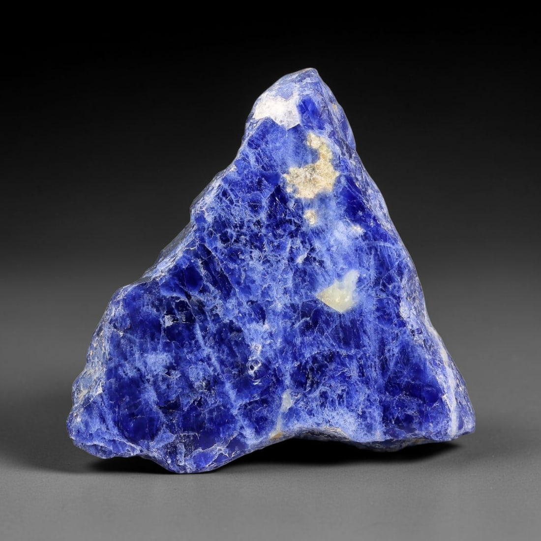124.26 Carats Natural White Matrix Blue Sodalite Sliced Rough Stone, 67YR: This genuine natural sodalite sliced rough features rich deep blue mineral matrix interspersed with pale creamy white crystalline formations formed through igneous geological processes. Fine natural o