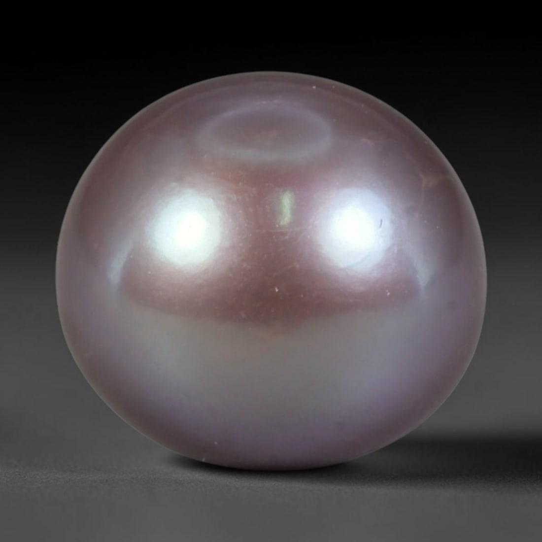 Natural Freshwater Pearl - Deep Lavender Mauve Sphere 11mm, 57WE: This natural freshwater pearl forms a smooth symmetrical spherical body wrapped in luminous iridescent nacre, displaying rich deep lavender blended with subtle mauve overtones across its polished surf