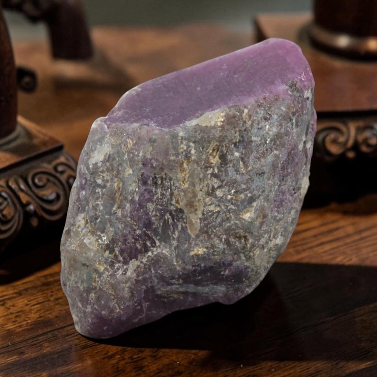 22.65ct Natural Mauritania Ruby Rough (Unheated), 86XE: This unheated Mauritania ruby rough is a captivating natural crystal specimen, featuring vivid magenta-purple ruby formations embedded in a contrasting greyish matrix. The stone's rugged, unpolished s