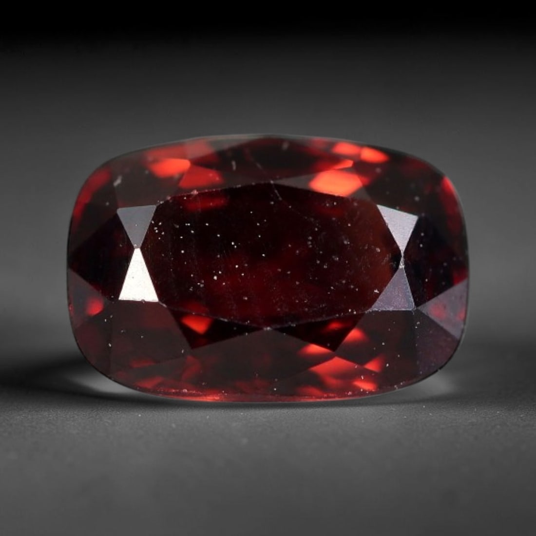 1.10 Carats Natural Deep Burgundy Red Garnet Faceted Loose Gemstone, 56WJ: This timeless faceted garnet boasts a luxuriously deep burgundy red tone that glows with vivid crimson fire across its precisely polished reflective facets. Fine natural micro mineral specks are scatt
