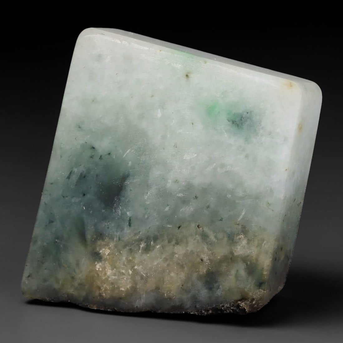 200ct Natural Type A Burmese Jadeite Jade Sliced Rough, 22YK: This specimen is a sliced rough block of natural Type A Burmese jadeite jade. The interior displays natural colour zoning with visible mineral veining and crystalline patterns typical of unprocessed j