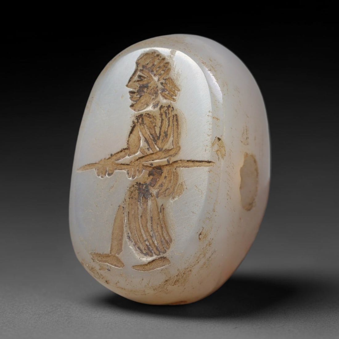 Ancient Sasanian Hand Engraved Translucent Stone Stamp Seal Talisman, 10WT: Miniature antique perforated sealing artifact expertly worked from natural pale translucent chalcedony mineral, originating from ancient Sasanian Persian imperial craft and cultural traditions. Fine t