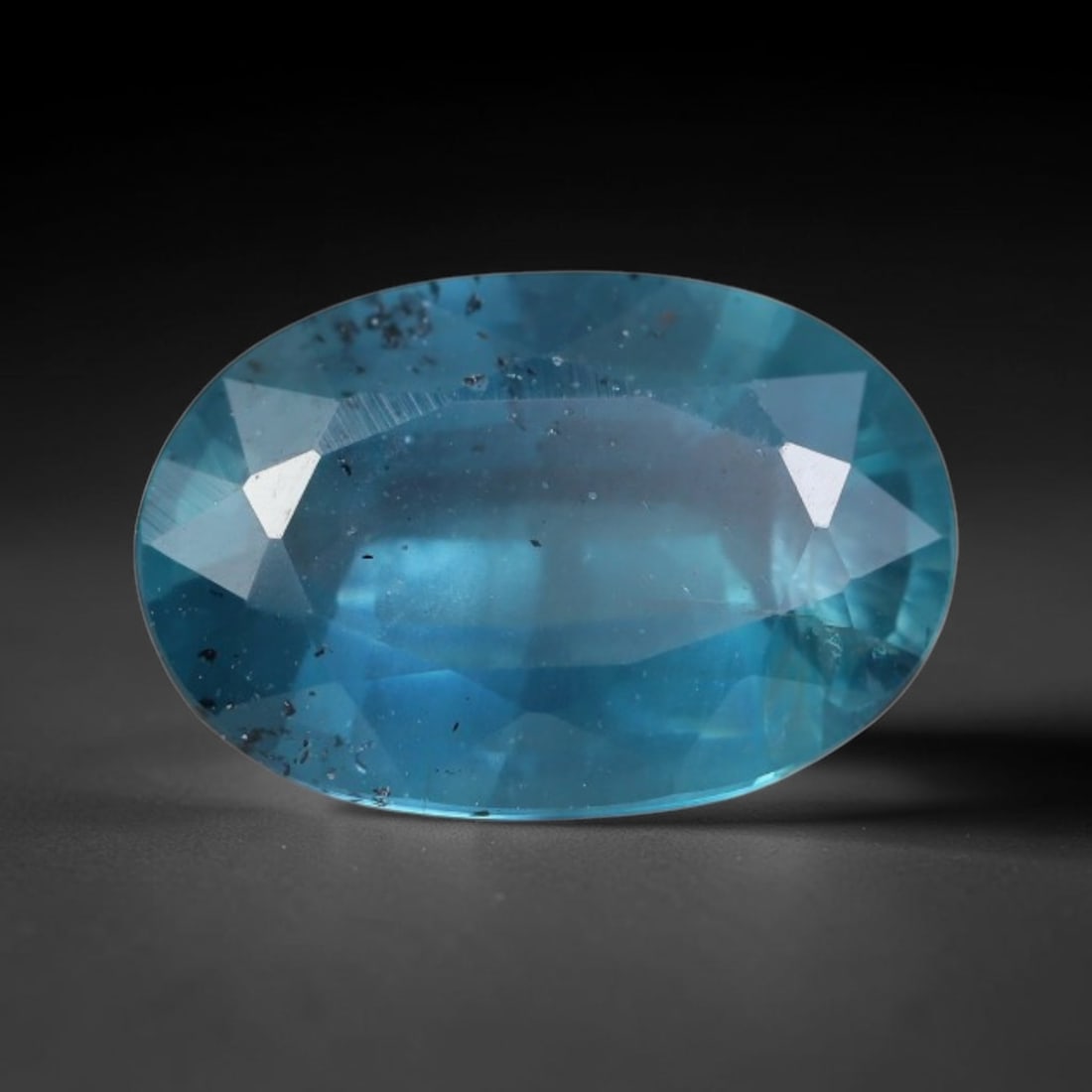 3.55 Carats Natural Deep Teal Blue Kyanite Oval Faceted Loose Gemstone, 26WS: This well-proportioned oval faceted kyanite boasts rich saturated teal-cornflower blue hue radiating through crisp polished step facets, with characteristic fine natural mineral inclusions and tiny da