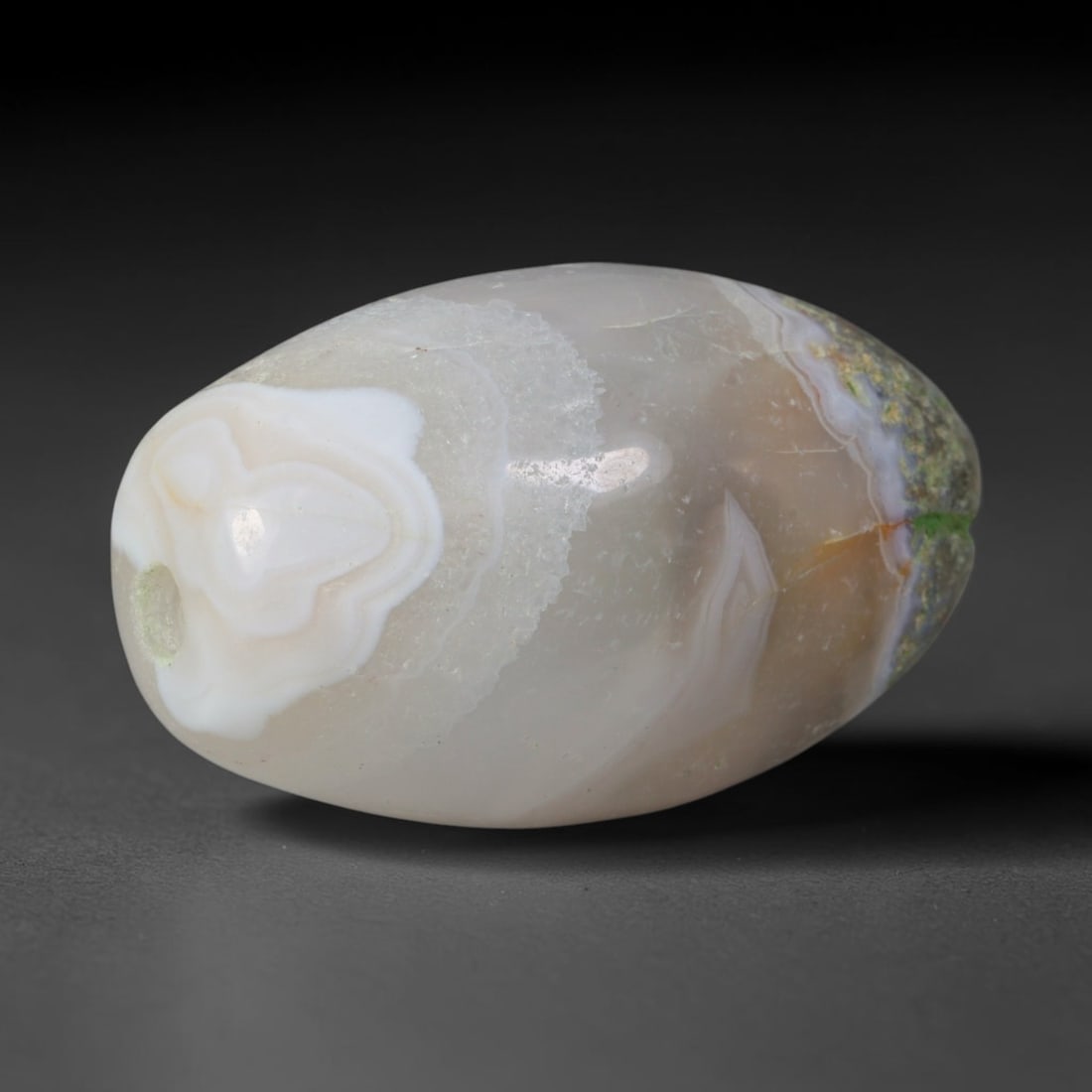 Ancient Sasanian Persian Empire Banded Agate Barrel Bead (224-651 CE), 13XV: This antique banded agate barrel bead originates from the Sasanian Persian Empire, a major late antique West Asian culture renowned for refined agate talisman and court bead production along Persian G