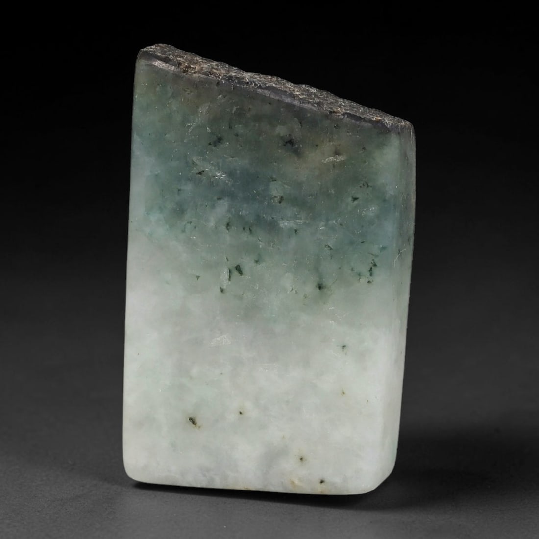 171ct Natural Type A Burmese Jadeite Jade Sliced Rough, 56YR: This specimen is a sliced rough block of natural Type A Burmese jadeite jade. The interior displays natural colour zoning with visible mineral veining and crystalline patterns typical of unprocessed j
