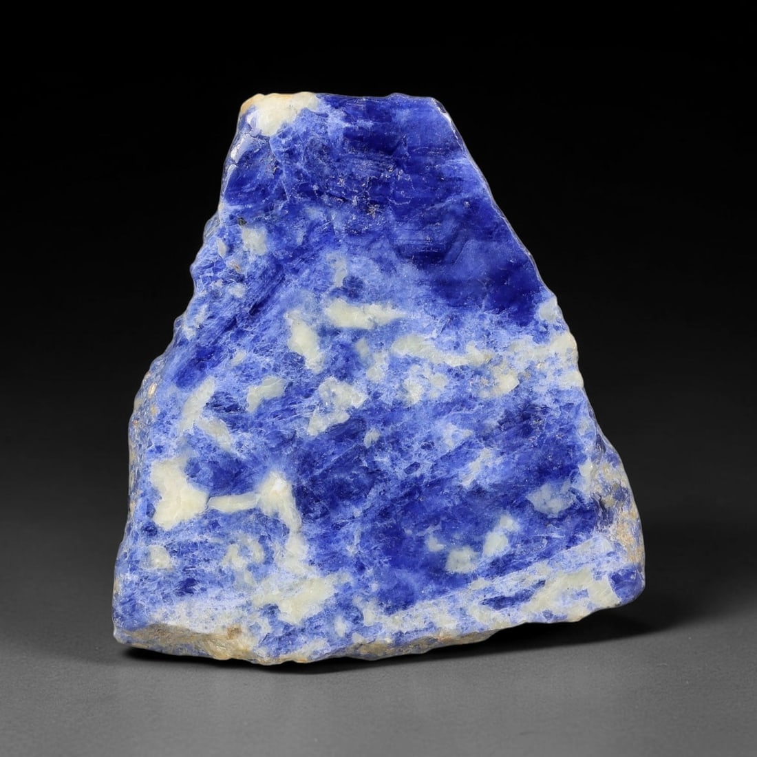 156.83 Carats Natural White Matrix Blue Sodalite Sliced Rough Stone, 66YR: This genuine natural sodalite sliced rough features rich deep blue mineral matrix interspersed with pale creamy white crystalline formations formed through igneous geological processes. Fine natural o