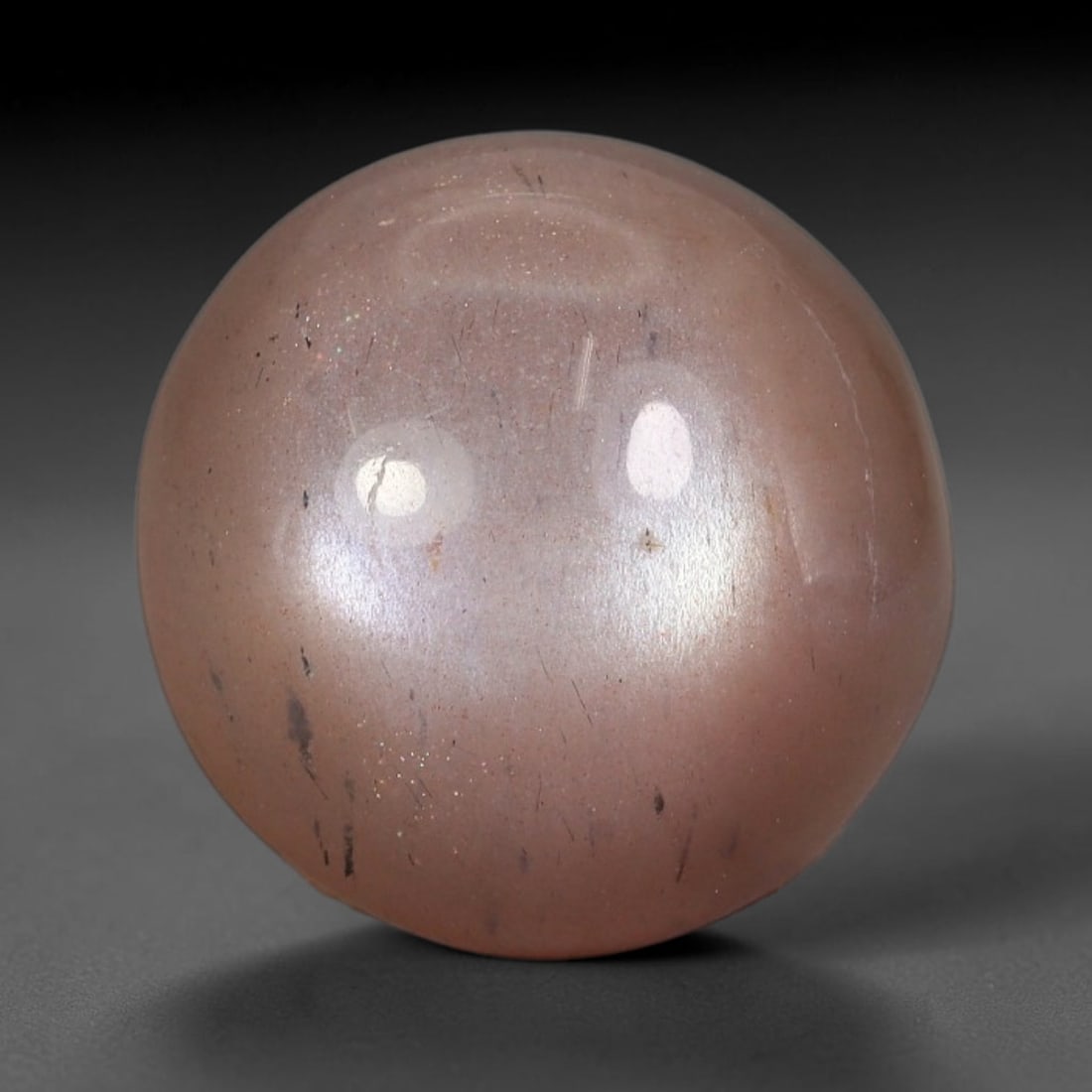10.16 Carats Natural Ceylon Peach Moonstone Loose Gemstone, 49WJ: This natural Ceylon moonstone carries dimension measurements of 14.3x7.4mm, a premium feldspar mineral sourced from Ceylon's historic moonstone mining grounds celebrated for stones displaying characte