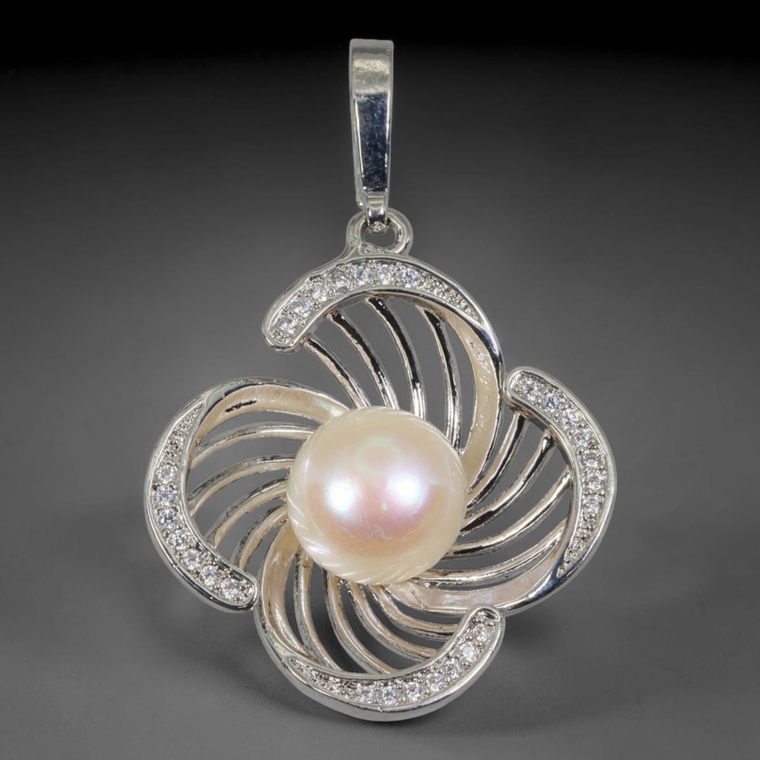 Swirl Four-Petal Floral Freshwater Pearl Clip-On Pendant with CZ Accents, 100WP: This elegant silver-toned clip bail pendant measures 31.2x27.3x9.3mm overall. A luminous soft peach iridescent freshwater pearl sits as the central focal point, boasting smooth surfaces and gentle rai