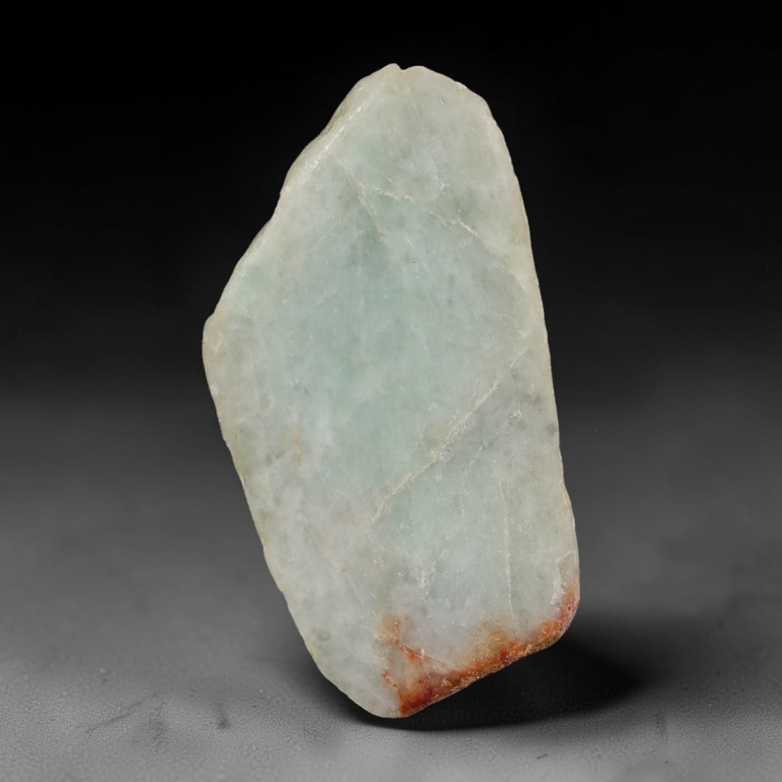248ct Natural Type A Burmese Jadeite Jade Sliced Rough, 46YR: This specimen is a sliced rough block of natural Type A Burmese jadeite jade. The interior displays natural colour zoning with visible mineral veining and crystalline patterns typical of unprocessed j