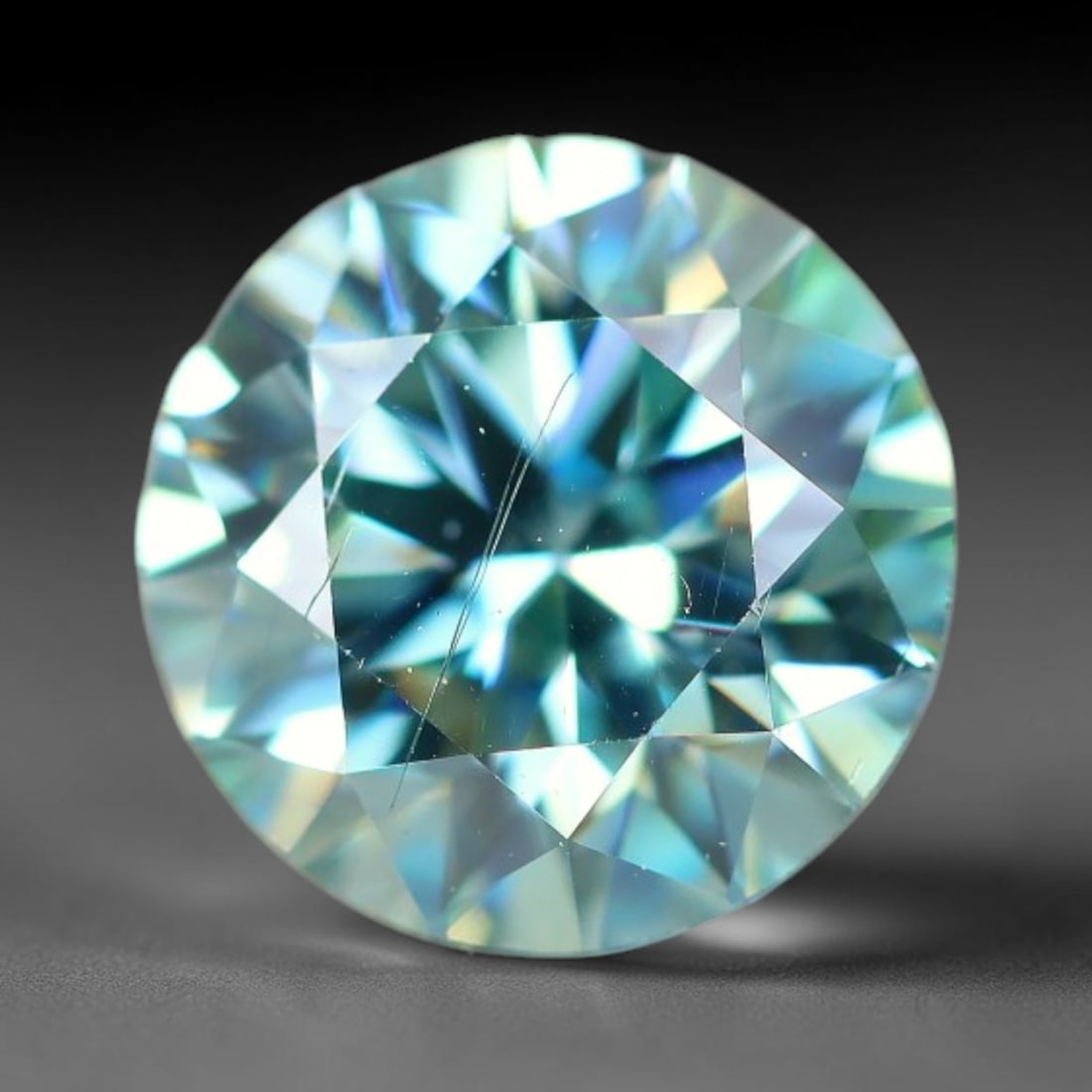 0.97 Carats Natural Green Toned Moissanite Loose Gemstone, 53WP: This lab grown moissanite measures 6.5x4mm, crafted from silicon carbide material well known for exceptional refractive index that generates bright, multi-faceted light dispersion in all lighting envi