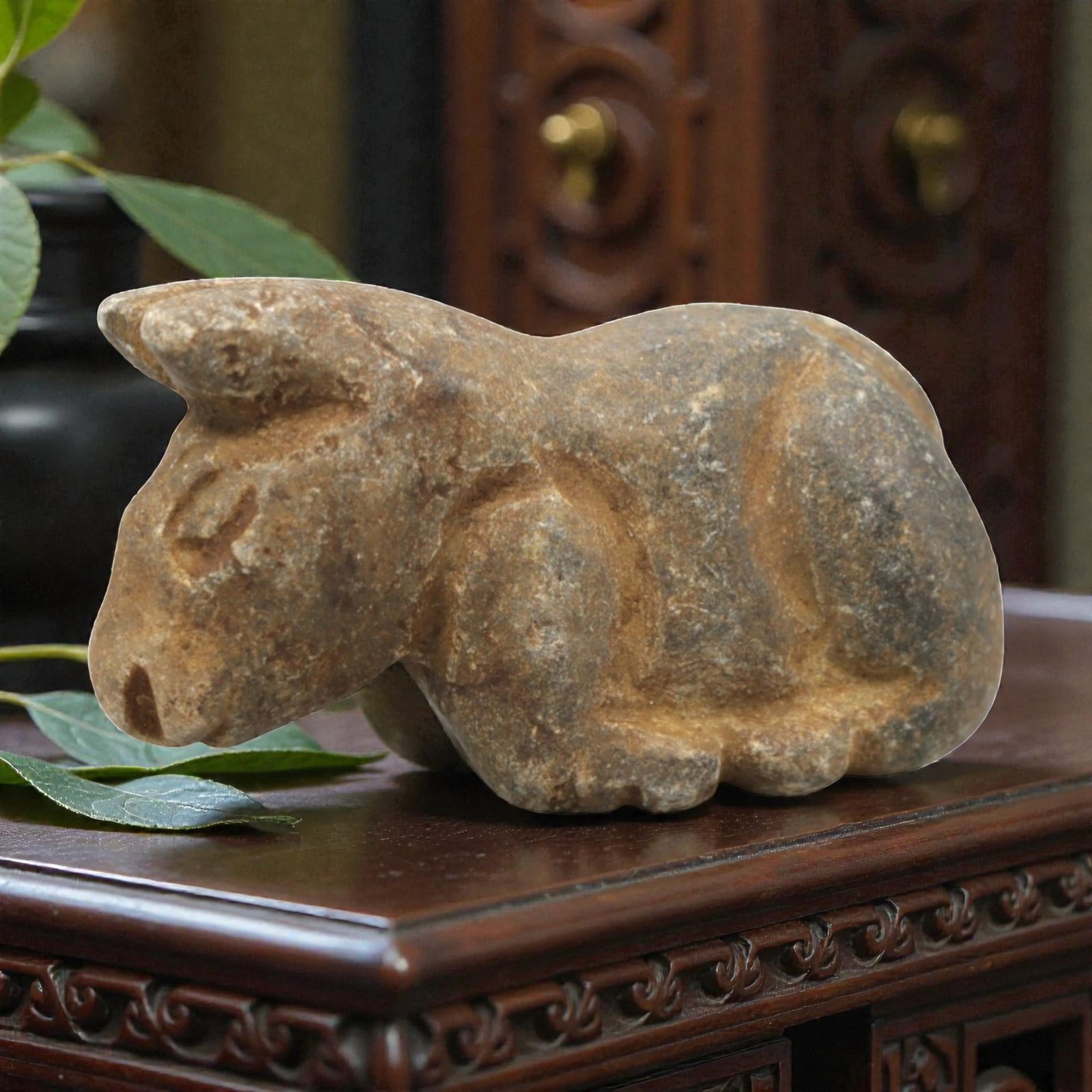 Ancient Stone Bovid Amulet - Near Eastern Animal Figurine, 27ZR: This artifact is a carved stone bovid amulet, executed in the stylized zoomorphic tradition of the ancient Near East. The amulet depicts a recumbent bovid (likely a bull or ox) with simplified anatomi