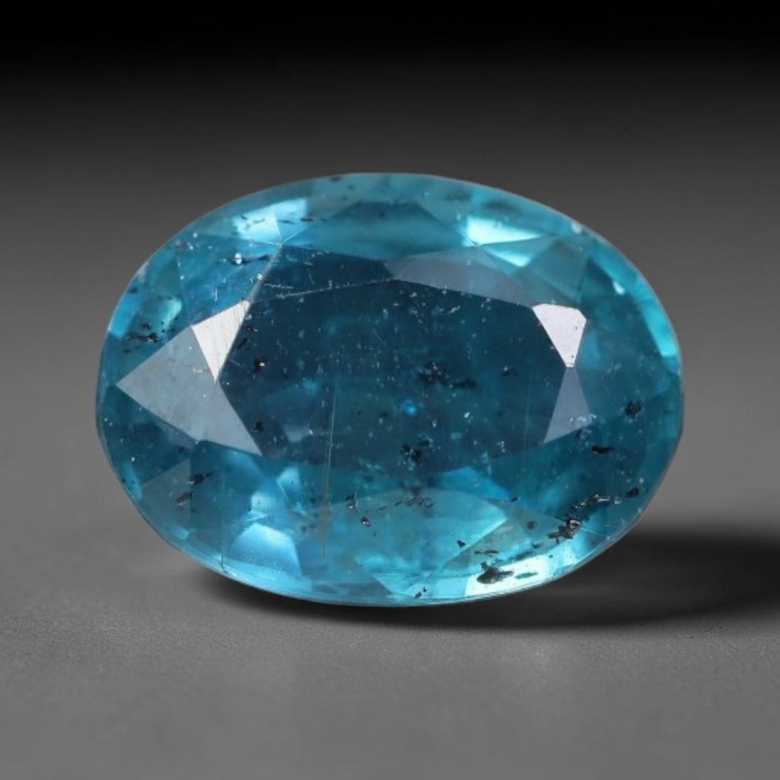 2.69 Carats Natural Deep Teal Blue Kyanite Oval Faceted Loose Gemstone, 24WS: This well-proportioned oval faceted kyanite boasts rich saturated teal-cornflower blue hue radiating through crisp polished step facets, with characteristic fine natural mineral inclusions and tiny da