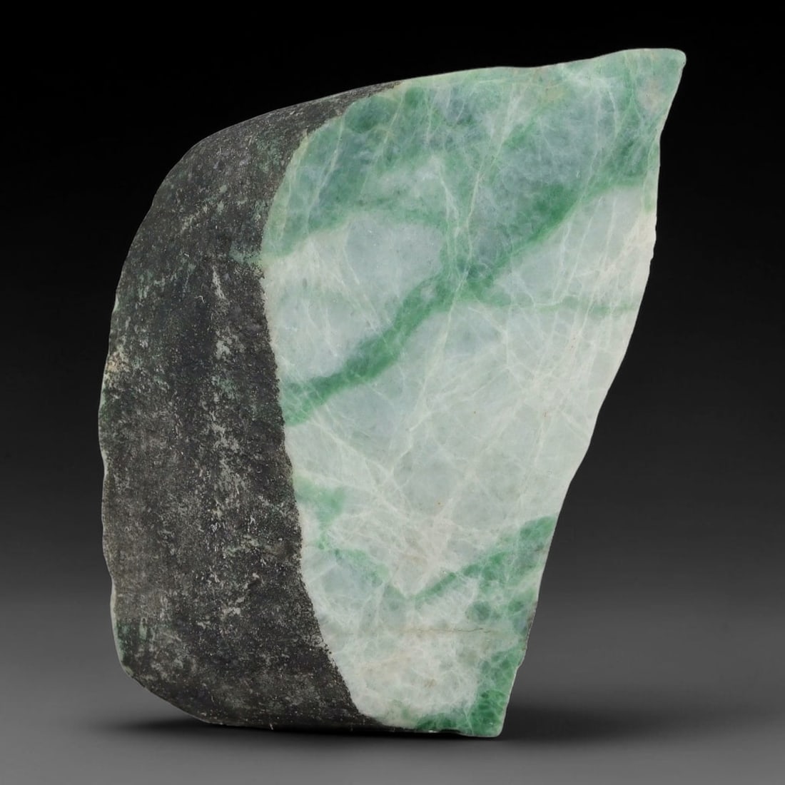 165ct Natural Type A Burmese Jadeite Jade Sliced Rough, 72YN: This specimen is a sliced rough block of natural Type A Burmese jadeite jade. The interior displays natural colour zoning with visible mineral veining and crystalline patterns typical of unprocessed j