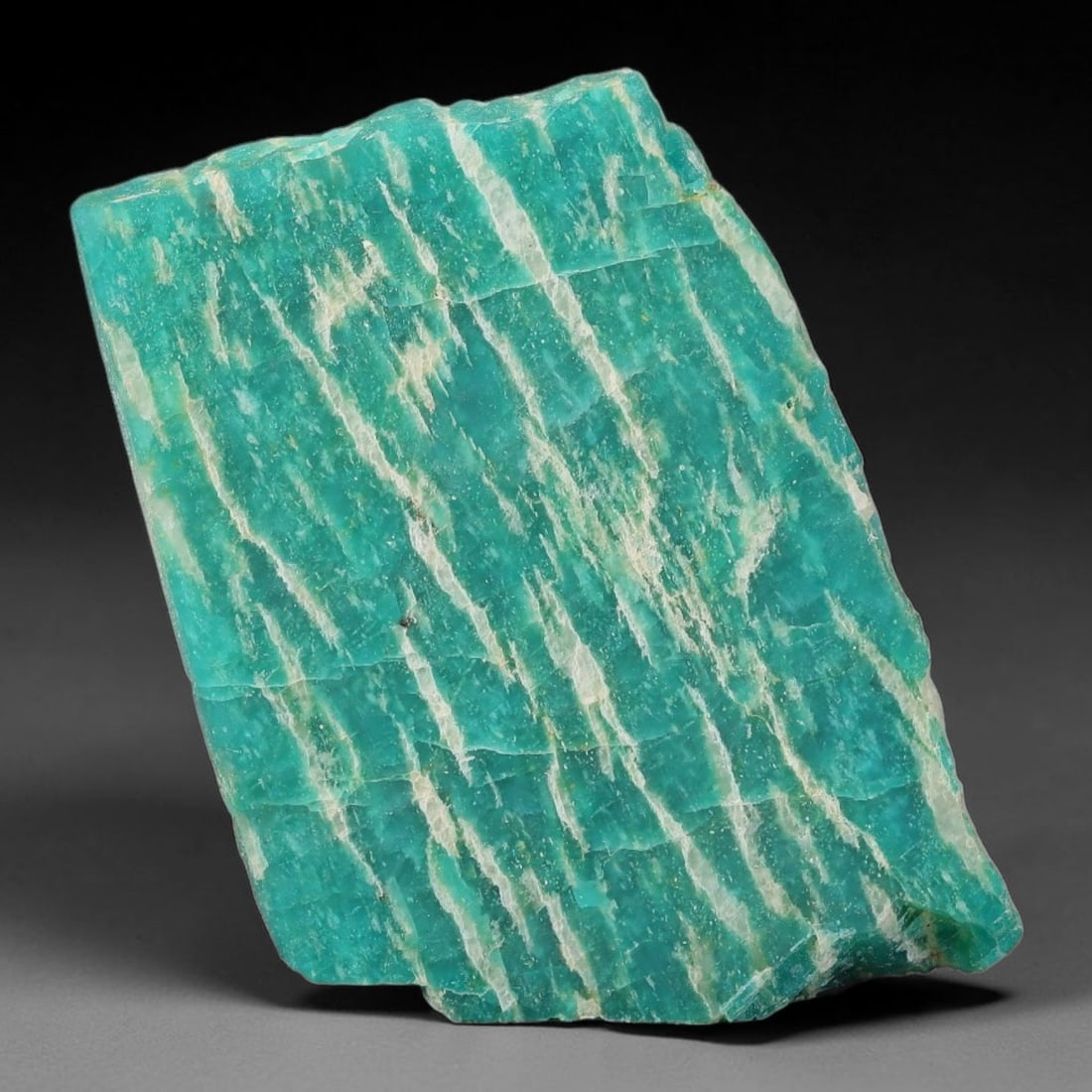 64ct Natural Russian Ural Amazonite Slab Rough, 10WV: This intact amazonite slab features distinct parallel mineral banding running uniformly across its naturally split flat surface within 41x30x5mm slab dimensions, retaining unmodified natural geologica
