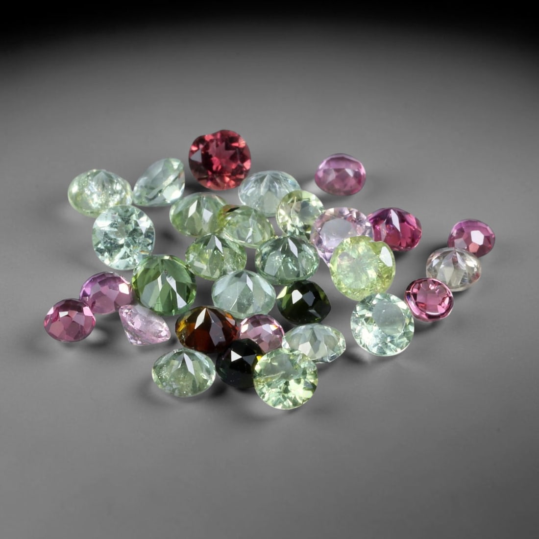 2.82 Carats Natural Multi-Color Tourmaline Round Faceted Parcel Lot, 39XZ: Let me share with you this really nice parcel of tiny mixed-color tourmalines, all thirty little beauties bundled right here together. You'll see such a fun varied palette across these stones: soft mi