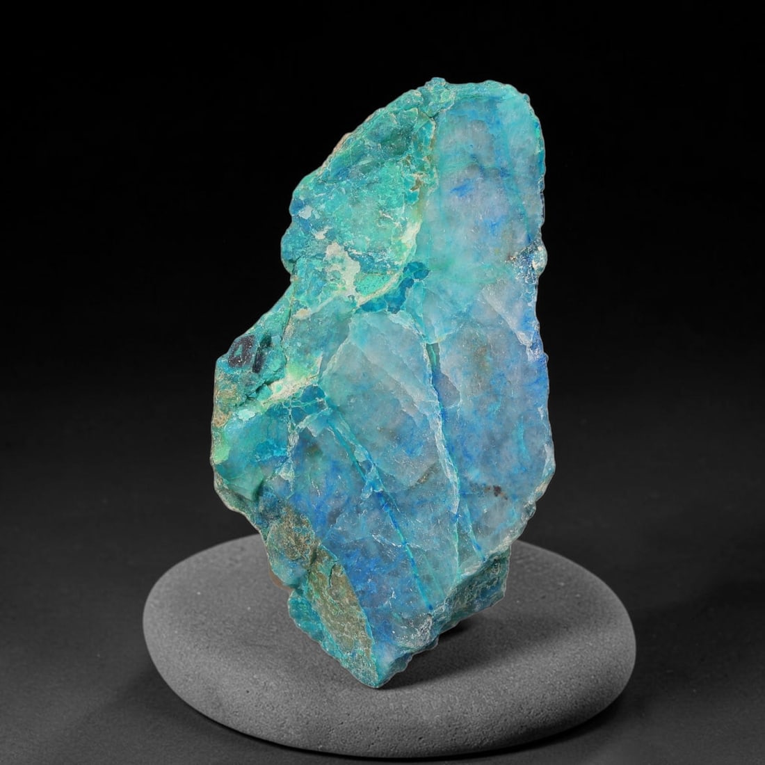 106ct Natural Peruvian Chrysocolla Polished Slab Rough, 62WV: This partial-polished chrysocolla slab features blended mineral matrix with smooth refined face and unaltered natural rugged edge across its 44x25x17mm elongated form, translucent mineral layers hold 