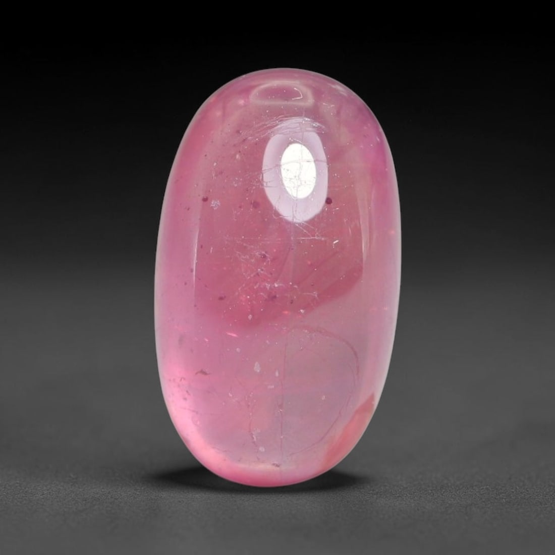 7.00 Carats Natural Mozambique Ruby Cabochon Loose Gemstone, 10XX: This ruby originates from Mozambique natural mineral deposits and receives professional cabochon grinding and polishing treatment to form a smooth glossy exterior surface. Tiny mineral particles and n