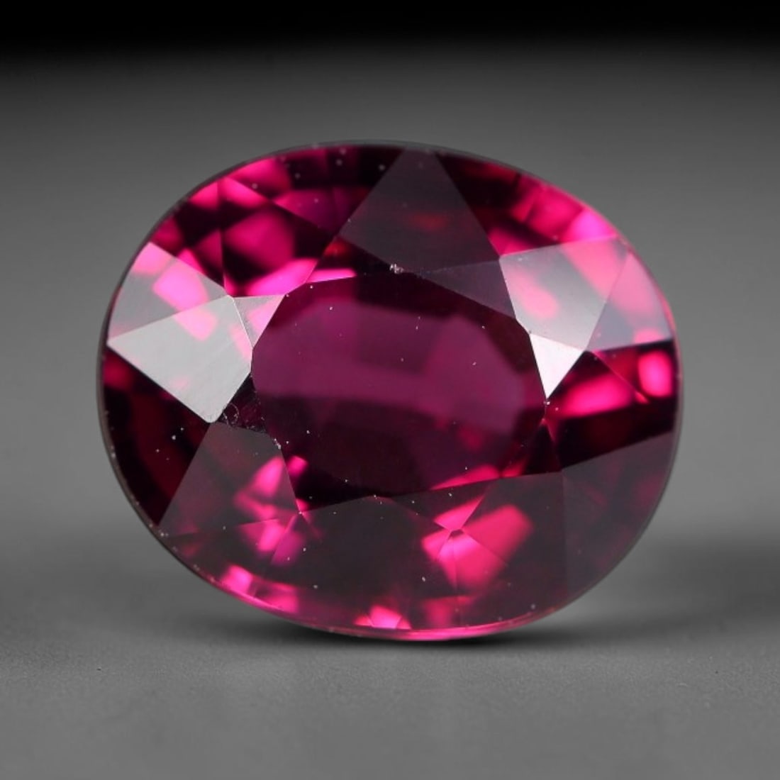 2.47 Carats Natural Deep Burgundy Red Garnet Oval Faceted Loose Gemstone, 71WY: This timeless oval faceted garnet boasts a luxuriously deep burgundy red tone that glows with vivid crimson fire across its precisely polished reflective facets. Fine natural micro mineral specks are 