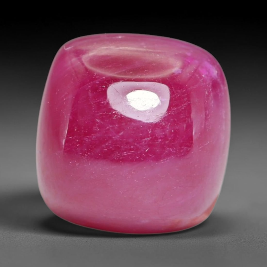 8.72 Carats Natural Mozambique Ruby Cabochon Loose Gemstone, 12XX: This ruby originates from Mozambique natural mineral deposits and receives professional cabochon grinding and polishing treatment to form a smooth glossy exterior surface. Tiny mineral particles and n