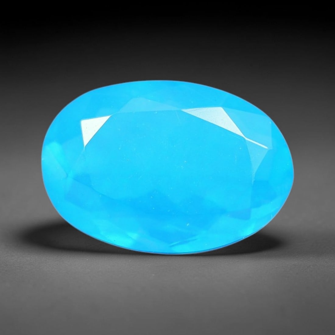 1.44 Carats Natural Ethiopian Welo Blue Fire Opal Oval Faceted Loose Gemstone, 79XX: This opal originates from Ethiopia's Welo opal deposits and is precision faceted and highly polished by professional lapidary workmanship across the whole exterior facet plane. Mild inherent internal 