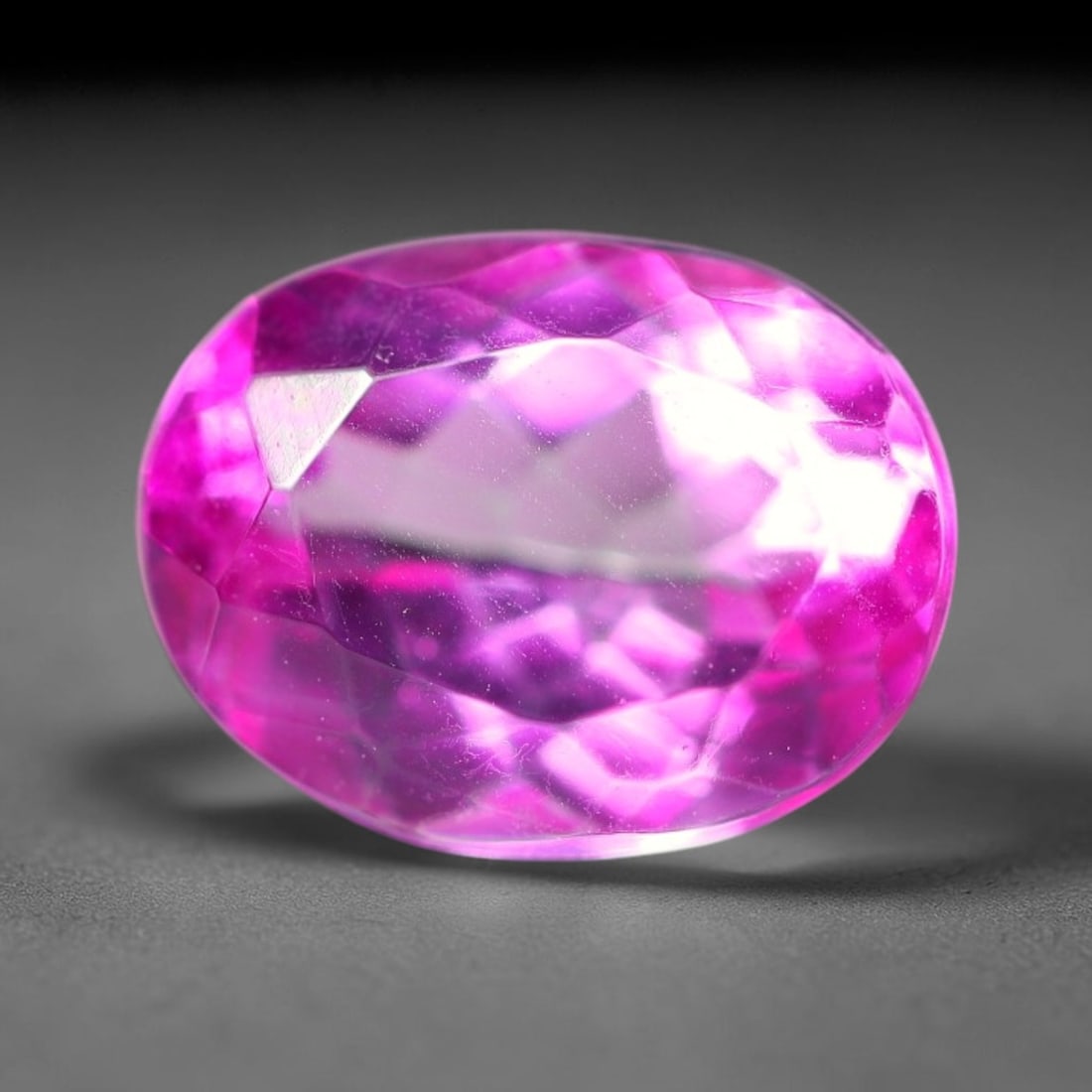 4.31 Carats Natural Brazilian Pink Topaz Oval Faceted Loose Gemstone, 85WY: This specimen is composed of natural topaz sourced from Brazilian mineral deposits, processed via professional faceted lapidary techniques with consistent glossy polishing applied to the entire crysta
