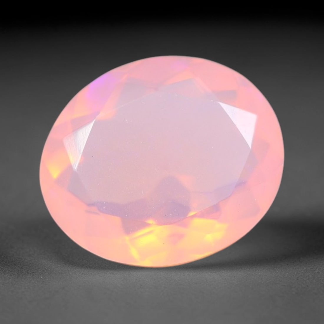 1.93 Carats Natural Ethiopian Welo Orange Fire Opal Oval Faceted Loose Gemstone, 75XX: This opal material is mined from the Welo deposits of Ethiopia and processed with professional faceted lapidary work with uniform polished facets across the gem surface. Natural subtle internal textur