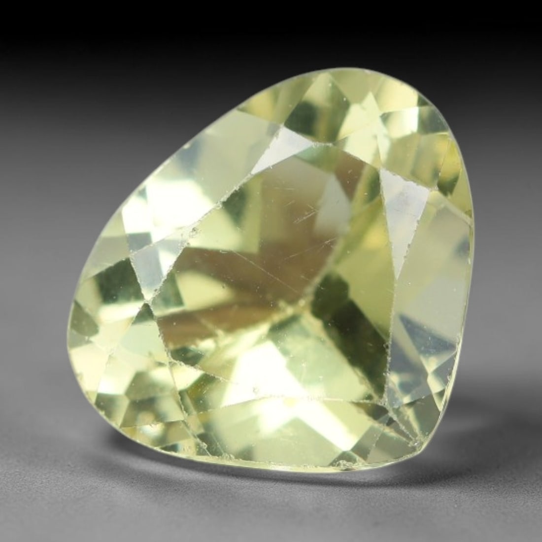 1.94 Carats Natural Pale Yellow Apatite Faceted Loose Gemstone, 54XY: This apatite specimen is sourced from natural geological deposits and shaped with professional faceting and high-gloss polishing work across the outer facet surfaces. Minute internal mineral inclusion