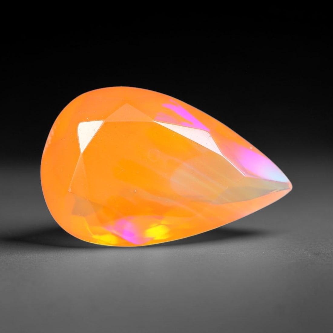 2.68 Carats Natural Ethiopian Welo Orange Fire Opal Pear Faceted Loose Gemstone, 85XX: This opal material is mined from the Welo deposits of Ethiopia and processed with professional faceted lapidary work with uniform polished facets across the gem surface. Natural subtle internal textur