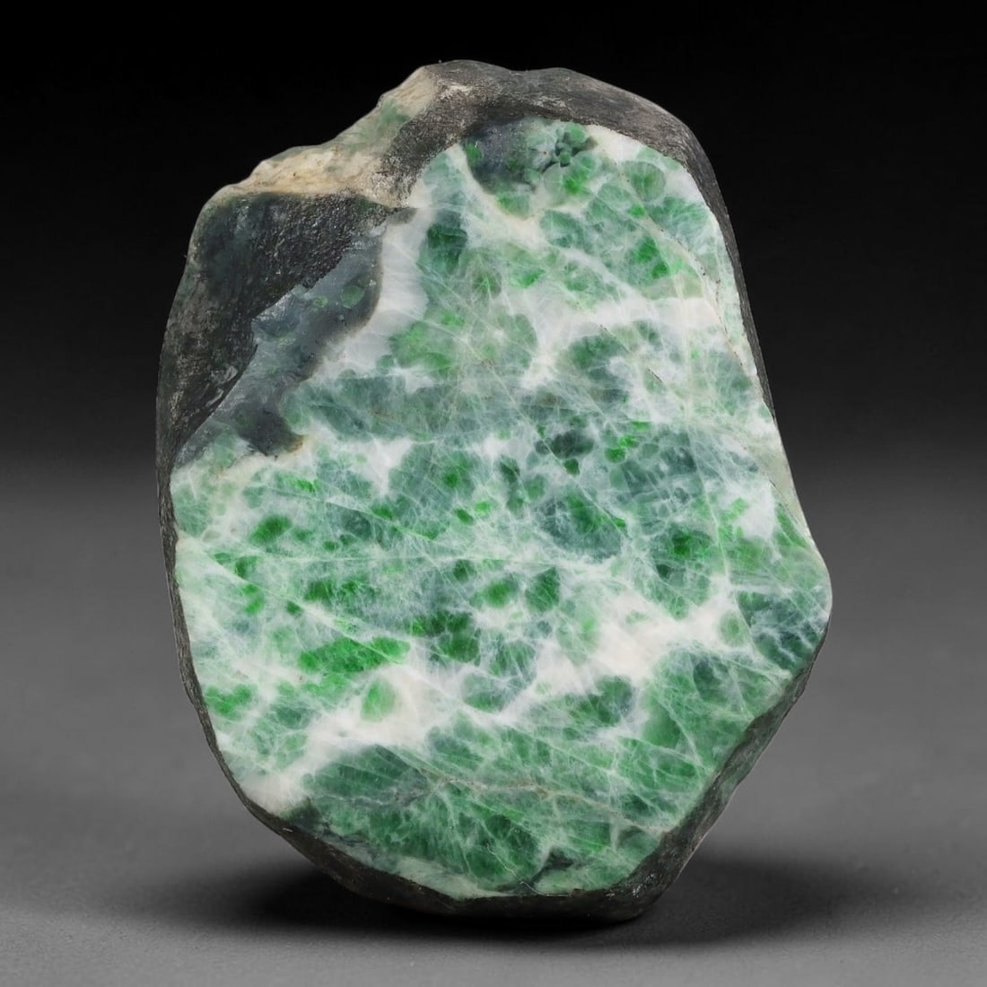330ct Natural Type A Burmese Jadeite Jade Sliced Rough, 7YK: This specimen is a sliced rough block of natural Type A Burmese jadeite jade. The interior displays natural colour zoning with visible mineral veining and crystalline patterns typical of unprocessed j