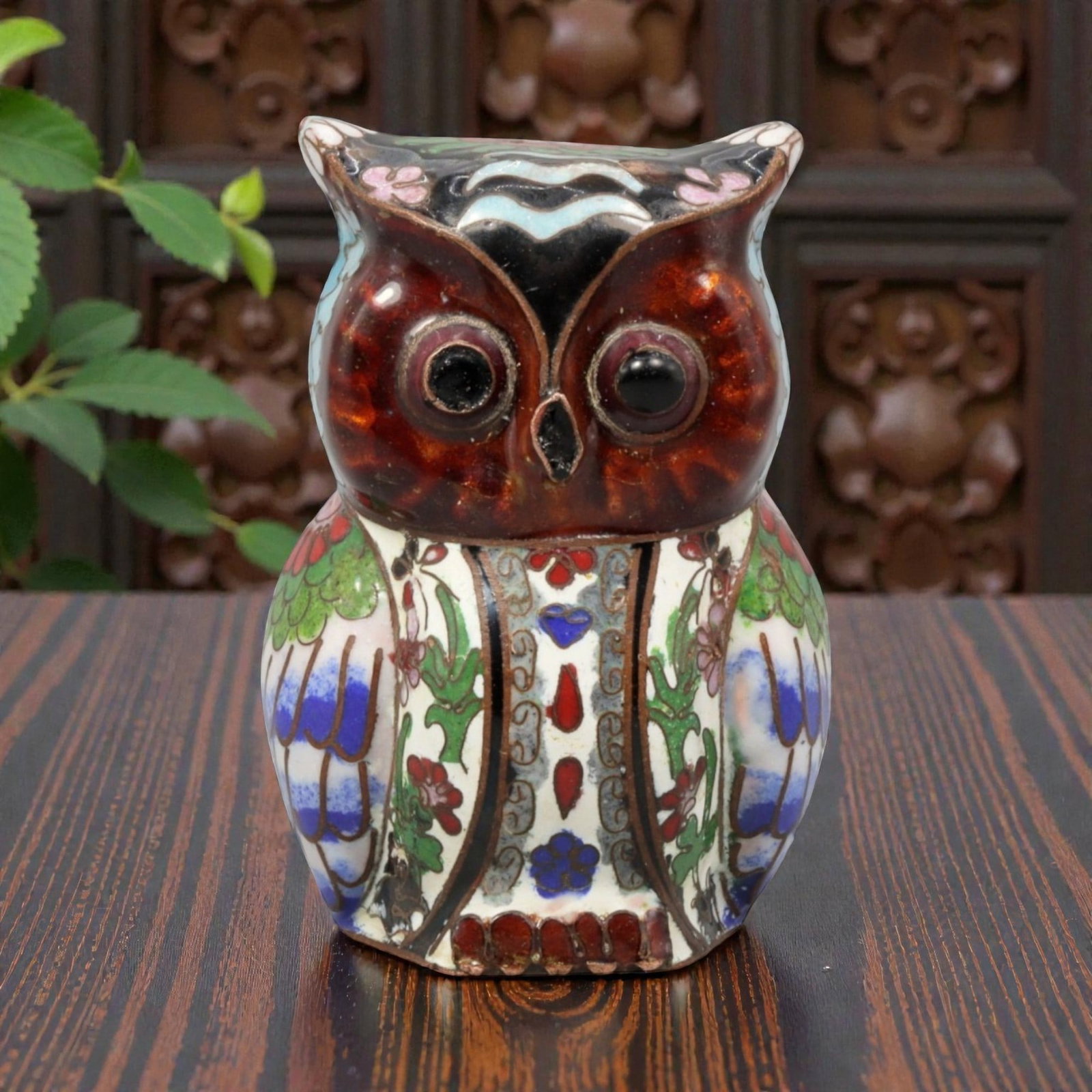 A Chinese Cloisonne Enamel Owl Effigy, 20th Century, 68YC: Constructed in copper and decorated with polychrome cloisonne enamel, the figure represents a standing owl with a rounded body and forward-facing posture. The head is prominently modeled with large ci